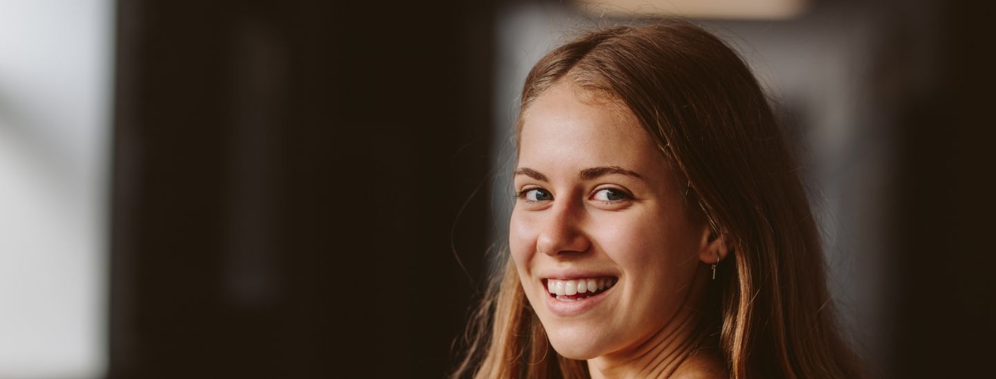 Student on campus smiling